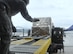 Staff Sgt. Darla Tokarski of the Wisconsin Air National Guard's 128th Logistics Readiness Squadron guides into position the 60K cargo handler driven by Staff Sgt. Tyler Cross, Air Transportation Specialist with the 81st Aerial Port Squadron out of Joint Base Charleston, S.C., at Ramstein AB, Germany, July 12, 2017.  Citizen Airmen of the 128th LRS and 81st APS performed two weeks of annual training at Ramstein in order to maintain readiness and familiarization with high-volume aerial port operations.  (U.S. Air Force photo by 1st Lt. Justin Clark)