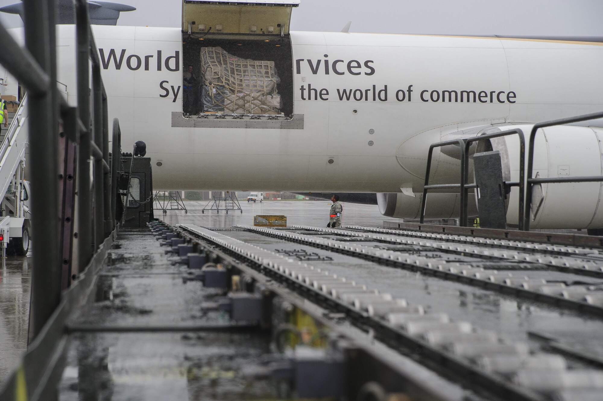 A 60K cargo handler is positioned at a cargo-laded aircraft at Ramstein AB, Germany, July 12, 2017.  Citizen Airmen of the 81st APS performed two weeks of annual training at Ramstein in order to maintain readiness and familiarization with high-volume aerial port operations.  (U.S. Air Force photo by Senior Airman Jonathan Lane)