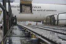 A 60K cargo handler is positioned at a cargo-laded aircraft at Ramstein AB, Germany, July 12, 2017.  Citizen Airmen of the 81st APS performed two weeks of annual training at Ramstein in order to maintain readiness and familiarization with high-volume aerial port operations.  (U.S. Air Force photo by Senior Airman Jonathan Lane)