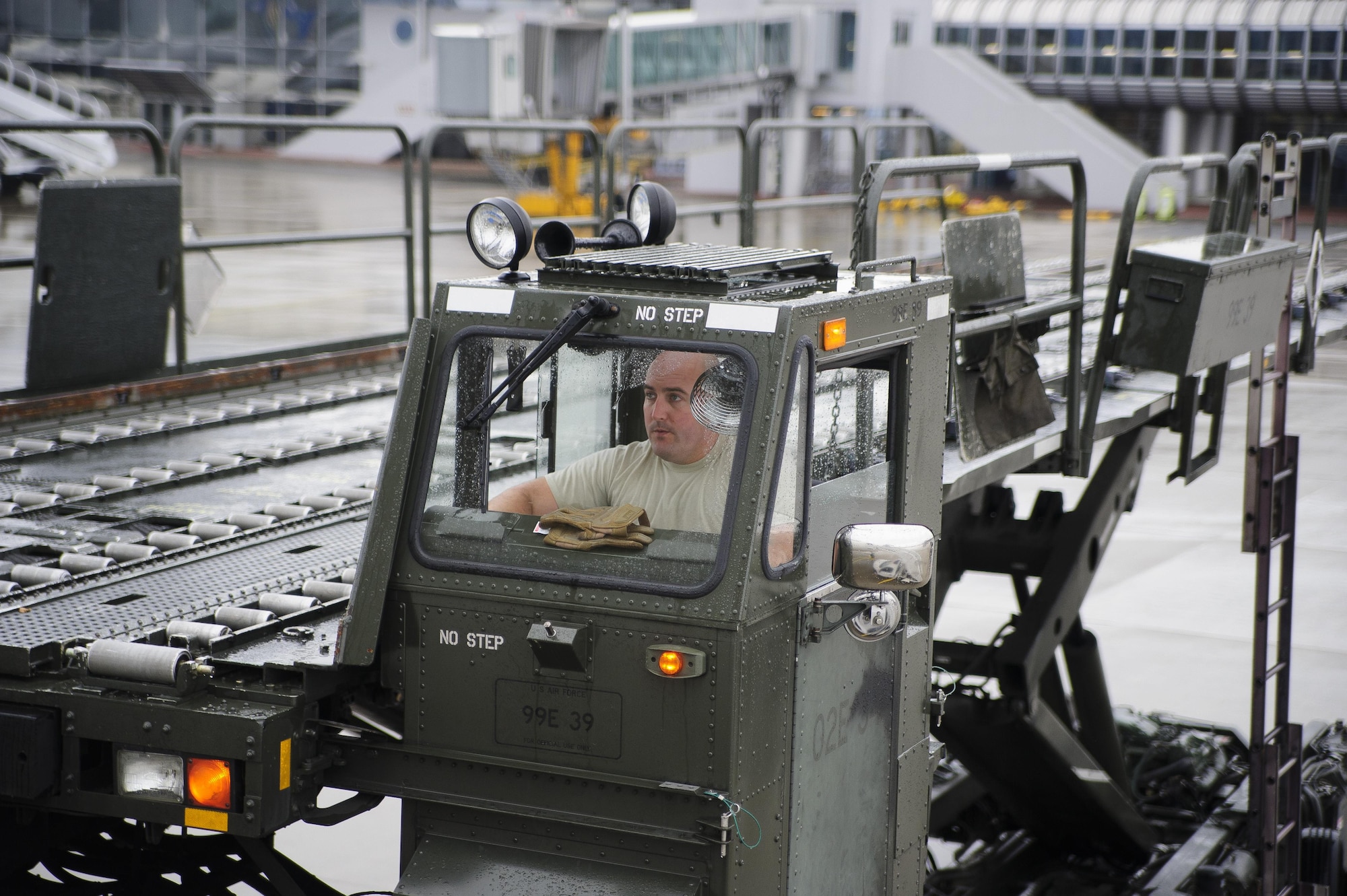 Staff Sgt. Anthony Pokorny, Air Transportation Journeyman with the 81st Aerial Port Squadron out of Joint Base Charleston, S.C., operates a 60K cargo lift while offloading air cargo at Ramstein AB, Germany, July 12, 2017.  Citizen Airmen of the 81st APS performed two weeks of annual training at Ramstein in order to maintain readiness and familiarization with high-volume aerial port operations.  (U.S. Air Force photo by Senior Airman Jonathan Lane)