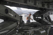 Staff Sgt. Tyler Cross, Air Transportation Journeyman with the 81st Aerial Port Squadron out of Joint Base Charleston, S.C., inspects a 60K cargo lift in preparation for unloading palletized air cargo on the ramp at Ramstein AB, Germany, July 12, 2017.  Citizen Airmen of the 81st APS performed two weeks of annual training at Ramstein in order to maintain readiness and familiarization with high-volume aerial port operations.  (U.S. Air Force photo by Senior Airman Jonathan Lane)