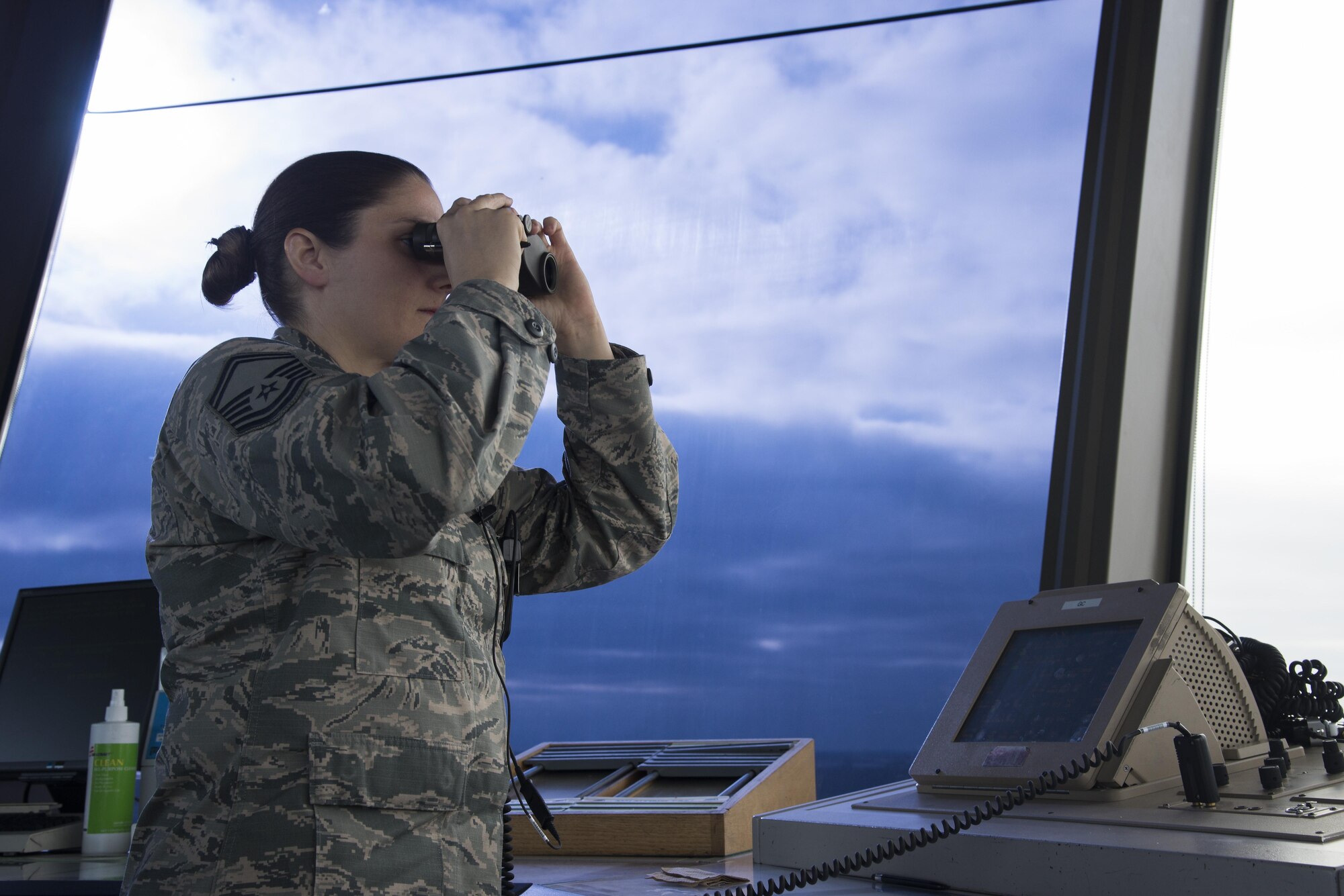Senior Master Sgt. Leigh Watreas, a 375th Operations Support Squadron air traffic controller checks the runway March 25, 2016, at Scott Air Force Base, Illinois. The lives of those in the air heavily depend on Airmen on the ground. Responsible for managing the flow of aircraft through all aspects of their flight, Air Traffic Control specialists ensure the safety and efficiency of air traffic on the ground and in the air. (U.S. Air Force photo by Airman 1st Class Gwendalyn Smith)