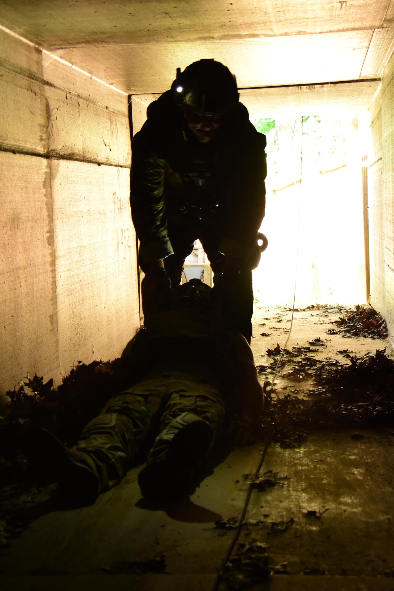 An Air National Guard explosive ordnance disposal specialist conducts a rapid personnel extraction during the Audacious Warrior exercise at Fort McCoy, Wis., July 27, 2017. The 12 day long exercise utilized the extensive training facilities of Volk Field Combat Readiness Training Center and Fort McCoy Total Force Training Center to provide EOD teams from eight different states comprehensive classroom and scenario based training in EOD tactics and procedures difficult to obtain at their respective home stations. (U.S. Air National Guard Photo by Master Sgt. Paul Gorman)