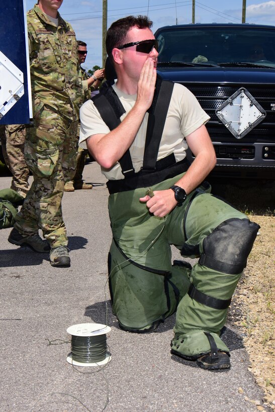 Senior Airman Bentley Davis, explosive ordnance disposal specialist with the Air National Guard's 147th Reconnaissance Wing in Houston, Texas warns area personnel of the impending explosion prior to detonating an improvised explosive device disruption charge during the Audacious Warrior exercise at Fort McCoy, Wis., July 27, 2017. The 12 day long exercise utilized the extensive training facilities of Volk Field Combat Readiness Training Center and Fort McCoy Total Force Training Center to provide EOD teams from eight different states comprehensive classroom and scenario based training in EOD tactics and procedures difficult to obtain at their respective home stations. (U.S. Air National Guard Photo by Master Sgt. Paul Gorman)