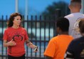 Sherri Biringer, 56th Force Support Squadron fitness specialist supervisor, briefs Airmen before a 1.5 mile run at Luke Air Force Base, Ariz., July 10, 2017. As the developer and head coach of the run clinic, Biringer implements a four week, high-intensity program to help Airmen perform better on their PT tests and achieve their fitness goals. (U.S. Air Force photo/Airman 1st Class Caleb Worpel)