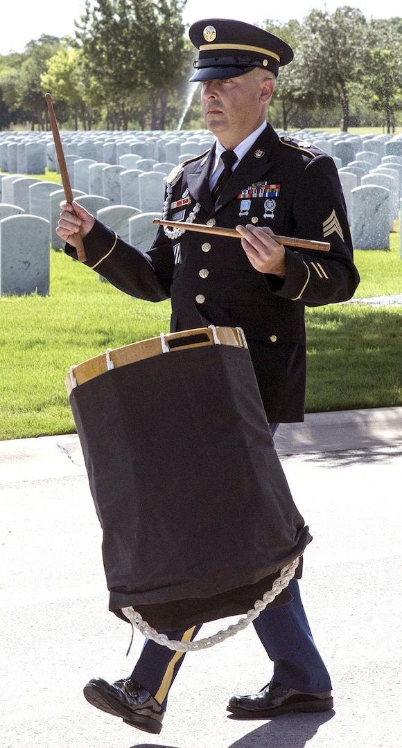 A member of the Joint Base San Antonio-Fort Sam Houston Honor Guard precedes the caisson carrying the remains of Army Cpl. Frank Sandoval. Sixty-six years after he was reported missing in action and died while serving in the Korean War, Sandoval was laid to rest in his hometown of San Antonio with military honors at Fort Sam Houston National Cemetery July 11.