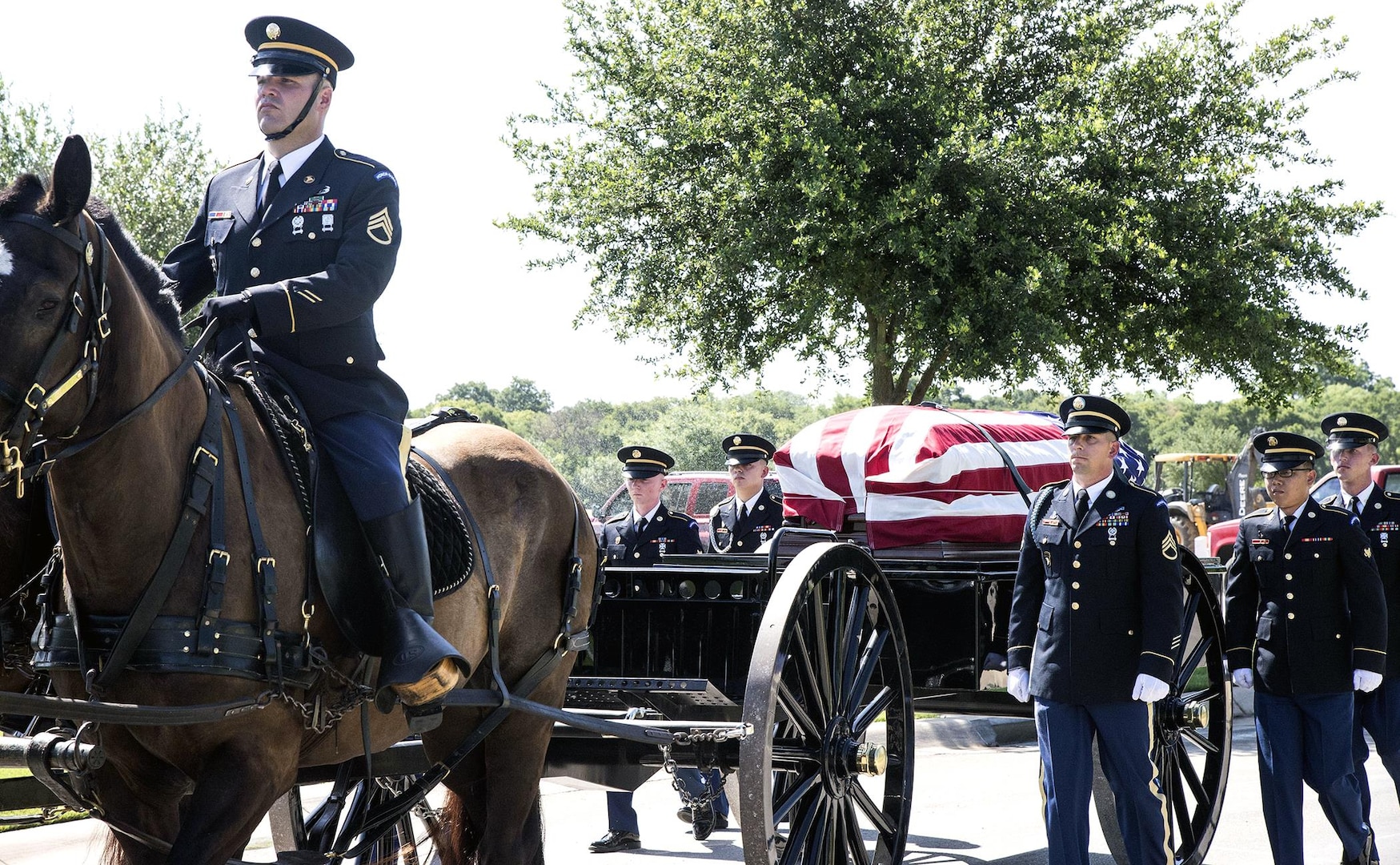 Members of the Joint Base San Antonio-Fort Sam Houston Honor Guard escort the caisson carrying the coffin with the remains of Army Cpl. Frank Sandoval to the assembly area at the Fort Sam Houston National Cemetery July 11.