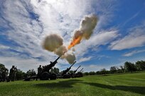 A salute battery assigned to Alpha Battery, 2nd Battalion, 122nd Field Artillery Regiment, Illinois Army National Guard, fires 105mm blank howitzer rounds at the 85th Support Command headquarters in Arlington Heights, Ill., July 9, 2017. Brig. Gen. Frederick R. Maiocco Jr., 85th Support Command commanding general, relinquished the command colors to Maj. Gen. Tracy A. Thompson, Deputy Commanding General for Support, U.S. Army Reserve. The Army Reserve’s 85th Support Command, partnered with First Army, is made up of 46 Army Reserve battalions, nine brigade support elements, and nearly 4,300 Soldiers and Civilians spanning the continental United States and Puerto Rico. The units generate combat-ready units and Soldiers for the Army that are trained, equipped and lethal to win the nation’s wars. 
(U.S. Army photo illustration by Master Sgt. Anthony L. Taylor)