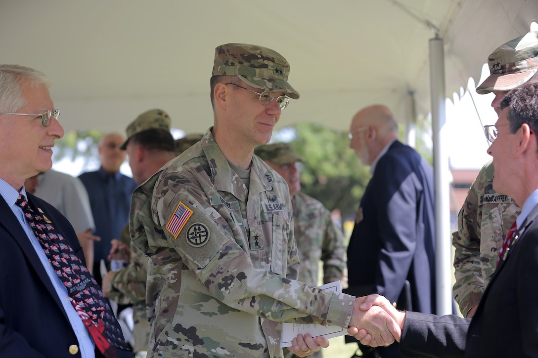 Maj. Gen. Chris R. Gentry, Deputy Commanding General for Support, First Army, shakes hands with Mayor Thomas Hayes, Mayor of Arlington Heights, after the 85th Support Command’s relinquishment of command ceremony, July 9, 2017. The 85th Support Command, partnered with First Army, is made up of 46 Army Reserve battalions, nine brigade support elements, and nearly 4,300 Soldiers and Civilians that spanned across the continental United States and Puerto Rico, and generate combat ready units and Soldiers for the Army that are trained, equipped and lethal to win the nation’s wars. 
(U.S. Army photo by Master Sgt. Anthony L. Taylor)