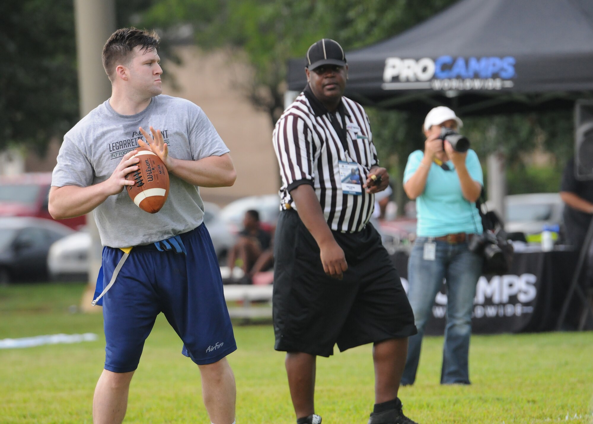 Senior Airman Jordan Johnson, 81st Security Forces patrolman, prepares to throw the ball during the P&G LeGarrette Blount 7x7 Football Championship July 8, 2017, on Keesler Air Force Base, Miss. Blount, Philadelphia Eagles National Football League running back, hosted the two-day camp consisting of 10 flag football teams from Keesler and the local community to promote the importance of living an active and healthy lifestyle. (U.S. Air Force photo by Senior Airman Holly Mansfield)