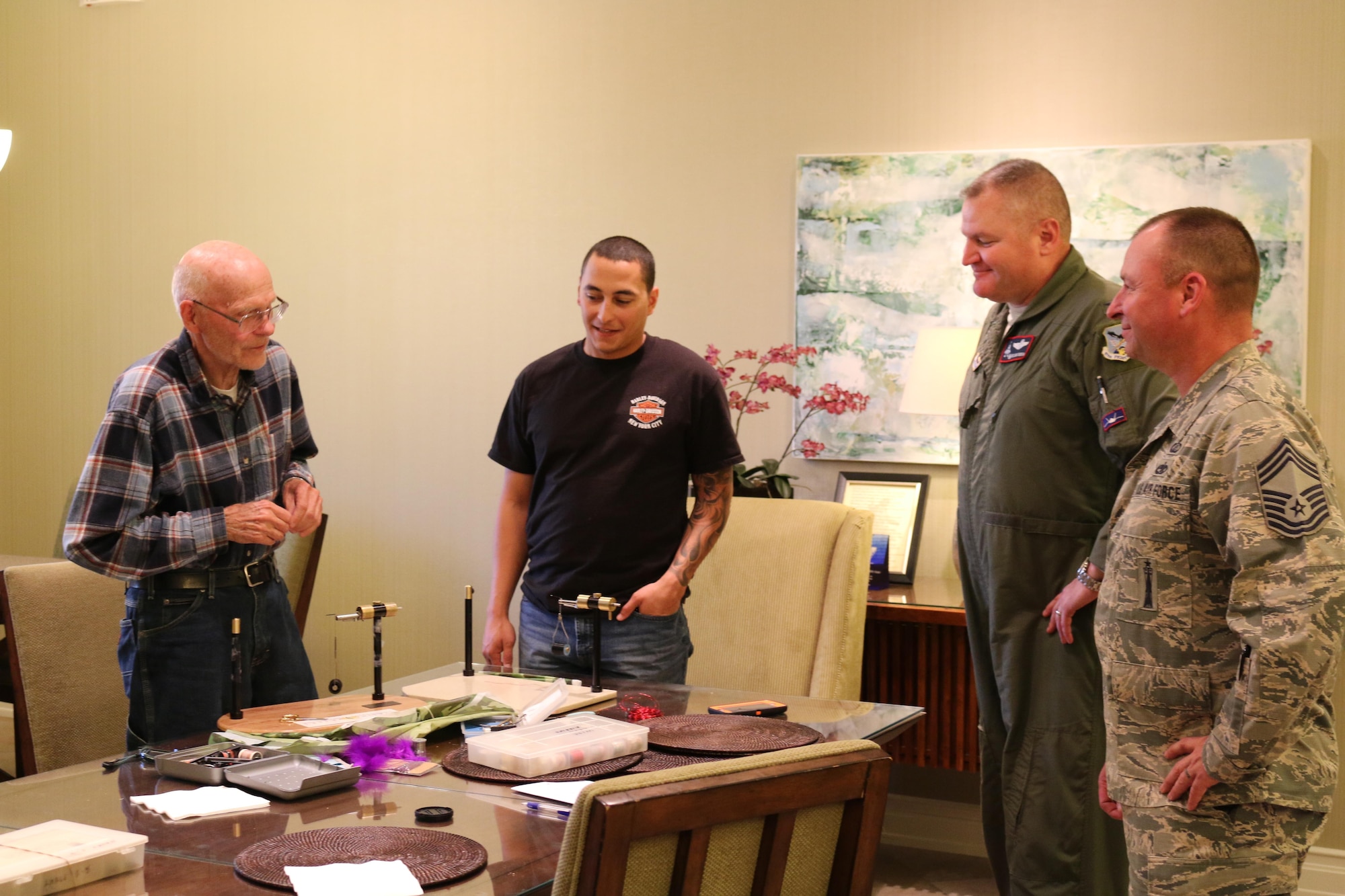 Col. Christopher Ogren, 477th Fighter Group Commander, and Chief Master Sgt. Garry Briner, 477 FG Command Chief, talk with veterans and their families at the Alaska Fisher House while hosting an evening dinner July 5, 2017. The Fisher House Foundation donates homes built on the grounds of major military and VA medical centers where family members can stay in order to be close to loved ones hospitalized for an unexpected illness, disease or injury. 


