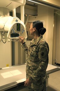 Sgt. 1st Class Trini Ta’s Call to Duty as a radiology technician at Soto Cano Air Base includes providing service for Joint Task Force-Bravo personnel as well as military working dogs, ensuring providers get the right images to help their patients. Sgt. Ta inspects equipment prior to receiving patients at the Medical Element July 5th, 2017. 
