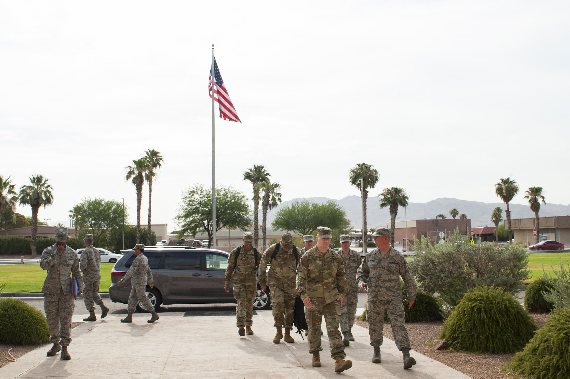Army Command Sgt. Maj. John Troxell (center), Senior Enlisted Advisor to the Chairman of the Joint Chiefs of Staff, arrives at the U.S. Air Force Warfare Center, Nellis Air Force Base, Nev, July 10, 2017. Throughout the day, Troxell received mission briefs from enlisted teams representing a number of critical Air Force organizations. (U.S. Air Force photo by Senior Airman Joshua Kleinholz)