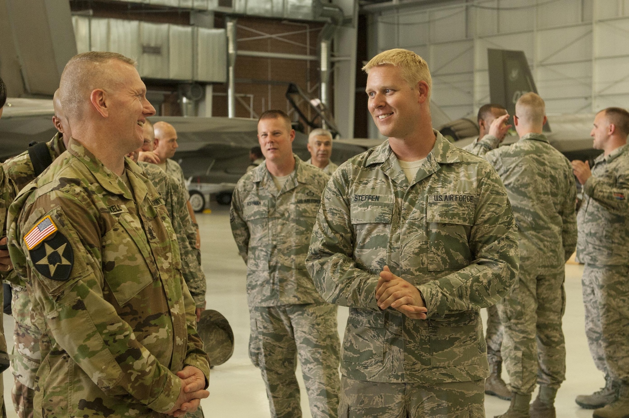 Army Command Sgt. Maj. John Troxell (left), Senior Enlisted Advisor to the Chairman of the Joint Chiefs of Staff, speaks with Airmen from the 57th Maintenance Group during a Nellis Air Force Base, Nev. visit July 10, 2017.  One of Troxell’s many duties as SEAC is to monitor the pulse of the joint enlisted force by identifying trends in morale and readiness. (U.S. Air Force photo by Senior Airman Joshua Kleinholz)