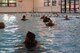 Air National Guard explosive ordnance disposal personnel complete a water swim test and drown-proofing in uniform as part of rappelling certification, and pool PT which included swimming, pushup and sit-ups during the Audacious Warrior exercise at Fort McCoy, Wis., July 21, 2017. The 12 day long exercise utilized the extensive training facilities of Volk Field Combat Readiness Training Center and Fort McCoy Total Force Training Center to provide EOD teams from eight different states comprehensive classroom and scenario based training in EOD tactics and procedures difficult to obtain at their respective home stations. (Air National Guard photo by Tech. Sgt. Meghan Skrepenski, 115th Fighter Wing Public Affairs)