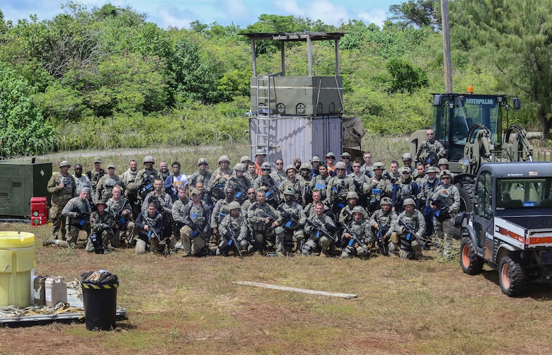 The 644th Combat Communication Squadron poses for a group photo after exercise Dragon Forge June 15, 2017, at Andersen South, Guam. Exercise Dragon Forge is a 164-hour training exercise designed to teach, train and build combat skills, while instilling the warrior ethos into CBCS Airmen. (U.S. Air Force photo by Airman 1st Class Christopher Quail)