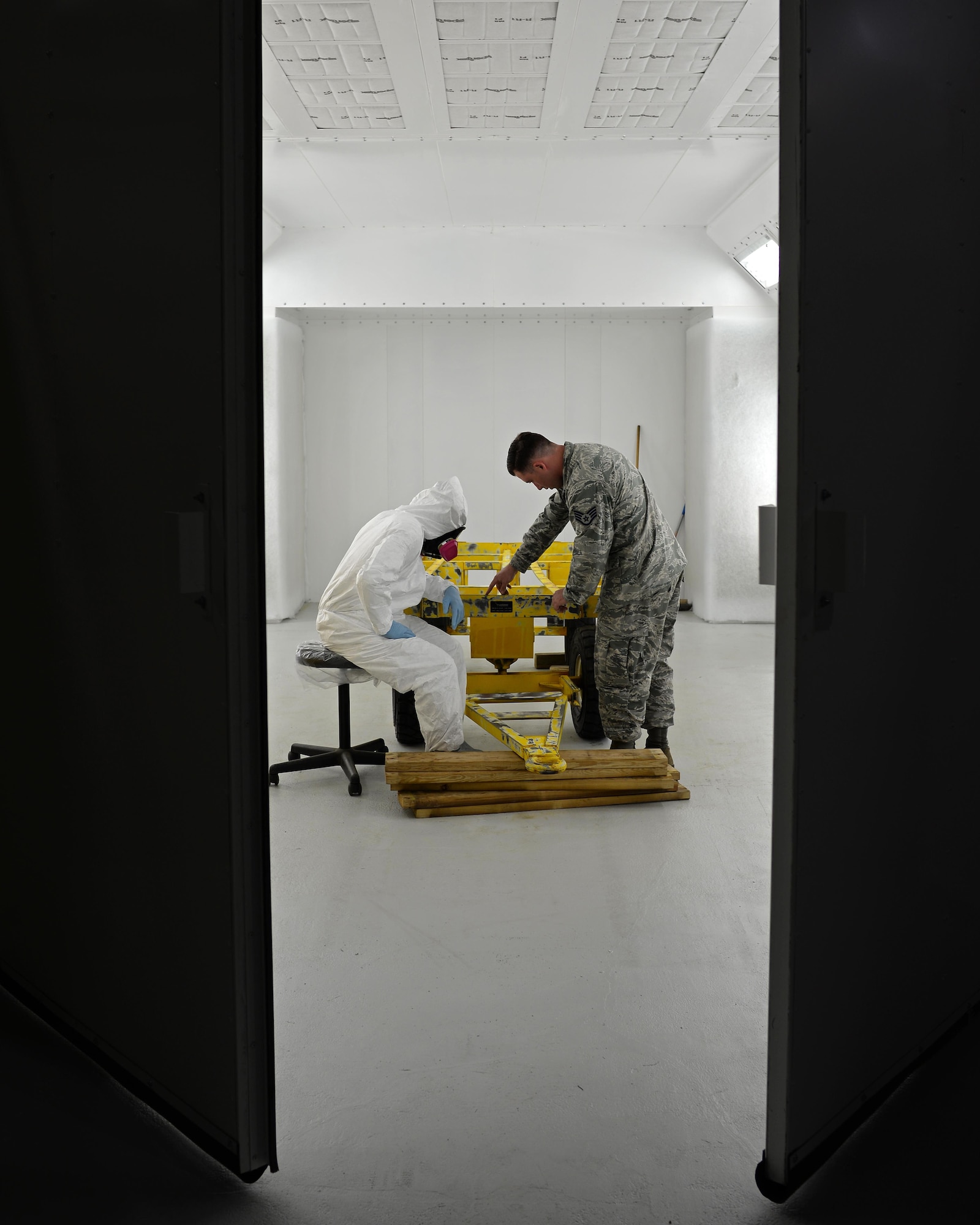 Senior Airman Jeremy Washington, 374th Maintenance Squadron aircraft structural journeyman, deployed from Yokota Air Base, Japan, (left) and U.S. Air Force Staff Sgt. Brendan McCormick, 36th Maintenance Squadron corrosion control NCO in charge, inspect a weapons trailer June 27, 2017, at Andersen Air Force Base, Guam. Airmen began work in Andersen’s new temporary corrosion control facility June 5th. (U.S. Air Force photo by Senior Airman Alexa Ann Henderson)