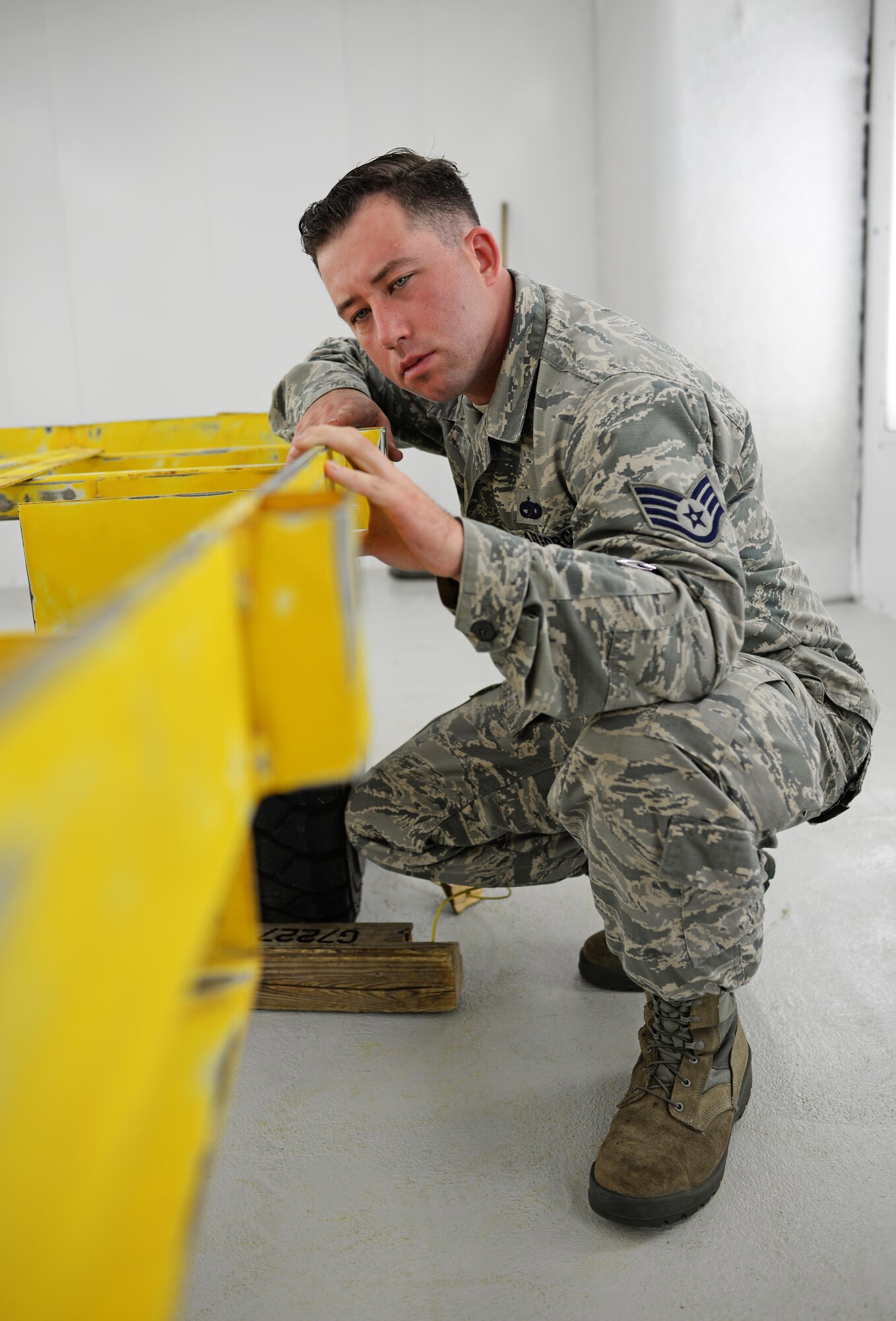 U.S. Air Force Staff Sgt. Brendan McCormick, 36th Maintenance Squadron corrosion control NCO in charge, inspects a weapons trailer June 27, 2017, at Andersen Air Force Base, Guam. Airmen began work in Andersen’s new temporary corrosion control facility June 5th. (U.S. Air Force photo by Senior Airman Alexa Ann Henderson)