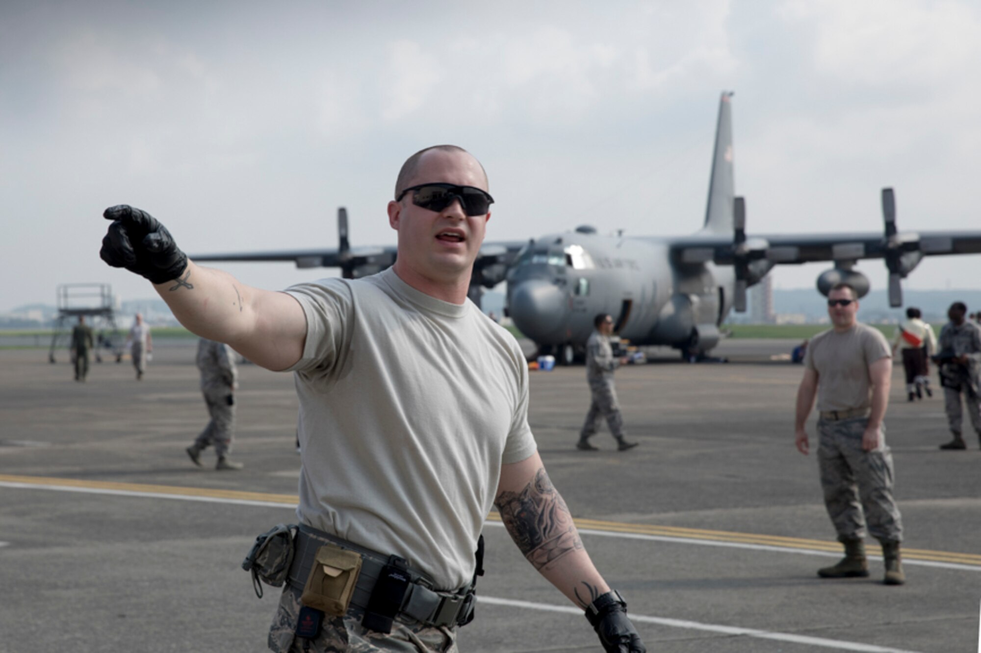 Tech. Sgt. Joshua Crook, 374th Surgical Operations Squadron team lead, directs his airmen during a major accident response exercise at Yokota Air Base, Japan, July 10, 2017. A major accident response exercise, or MARE, is designed to test a wing’s ability to respond to a variety of different events that could be disastrous to the installation and negatively impact the mission. (U.S. Air Force photo by Yasuo Osakabe)