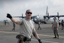 Tech. Sgt. Joshua Crook, 374th Surgical Operations Squadron team lead, directs his airmen during a major accident response exercise at Yokota Air Base, Japan, July 10, 2017. A major accident response exercise, or MARE, is designed to test a wing’s ability to respond to a variety of different events that could be disastrous to the installation and negatively impact the mission. (U.S. Air Force photo by Yasuo Osakabe)