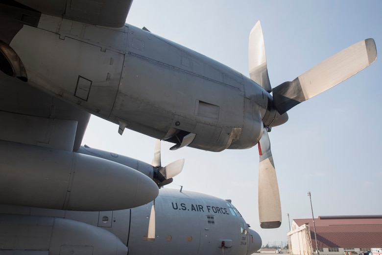 A U.S. Air Force C-130 Hercules sits on the flightline at Yokota Air Base, Japan, July 10, 2017, during a major accident response exercise. First responders with the 374th Medical Group, Yokota Fire Department, 374th Security Forces Squadron, Kyorin University Hospital, and Japan Air Self-Defense Force Air Defense Command participated in a MARE, simulating an on-base aircraft mishap. (U.S. Air Force photo by Yasuo Osakabe/Released)