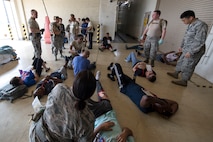 First responders assigned to the 374th Medical Group conducted a major accident response exercise July 10, 2017, in preparation for the upcoming Japanese-American Friendship Festival scheduled for Sept. 16-17. The training exercise simulated a C-130 Hercules accident with varying levels of injuries. Personnel conducted the drill to ensure they are ready for any aircraft emergency. (U.S. Air Force photo by Yasuo Osakabe)