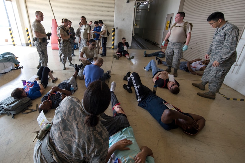 First responders assigned to the 374th Medical Group conducted a major accident response exercise July 10, 2017, in preparation for the upcoming Japanese-American Friendship Festival scheduled for Sept. 16-17. The training exercise simulated a C-130 Hercules accident with varying levels of injuries. Personnel conducted the drill to ensure they are ready for any aircraft emergency. (U.S. Air Force photo by Yasuo Osakabe)