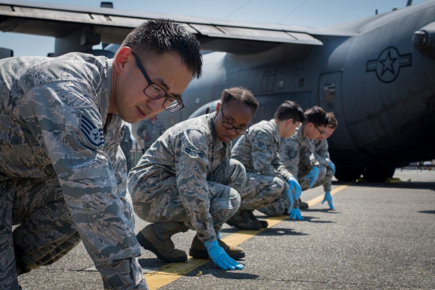 Airmen assigned to the 374th Force Support Squadron participate in a major accident response exercise, June 10, 2017, at Yokota Air Base, Japan. The training helps Airmen respond to a crisis situation they may face during a large casualty accident. (U.S. Air Force photo by Airman 1st Class Juan Torres)