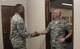 U.S. Air Force Chief Master Sgt. Anthony Johnson, left, the Pacific Air Forces' command chief, shakes hands with Col. R. Scott Jobe, the 35th Fighter Wing commander, right, during a visit at Misawa AIr Base, Japan, July 11, 2017. During his tour, Johnson met with various shops and organizations while sharing his goals for improving PACAF's enlisted force so they can work at their optimal level. (U.S. Air Force photo by Airman 1st Class Sadie Colbert)