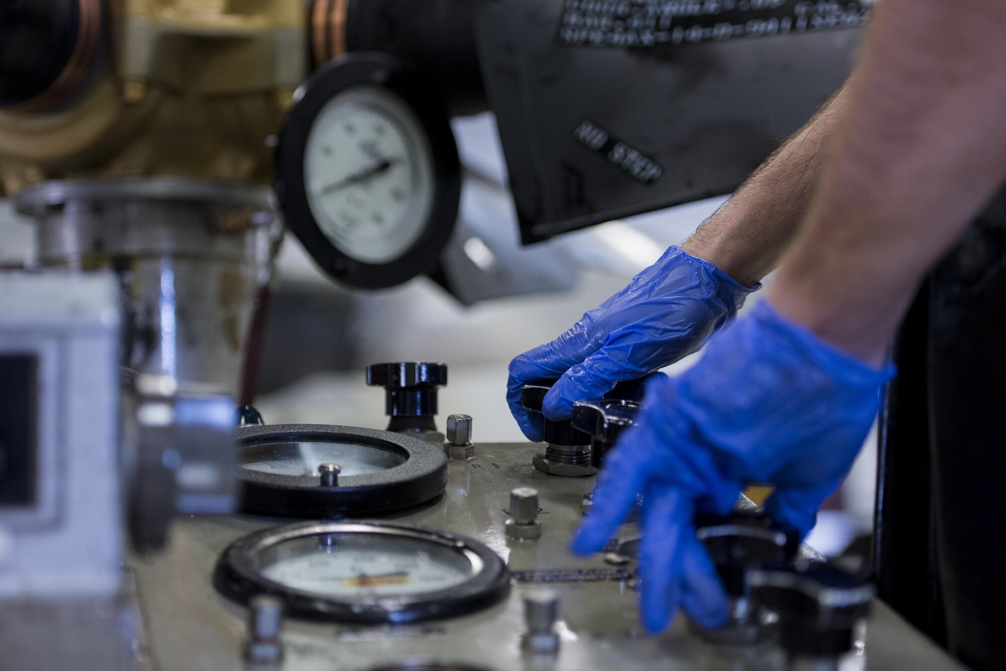 Senior Airman Jacob Lay, 374th Maintenance Squadron aerospace propulsion journeyman, adjusts a hydraulic testing machine during a MC-130 Talon II propeller test, July 12, 2017, at Yokota Air Base, Japan. The propeller test is an important step to ensure all the blades are aligned and the hydraulic systems are calibrated together within the props central hub. (U.S. Air Force photo by Airman 1st Class Donald Hudson)