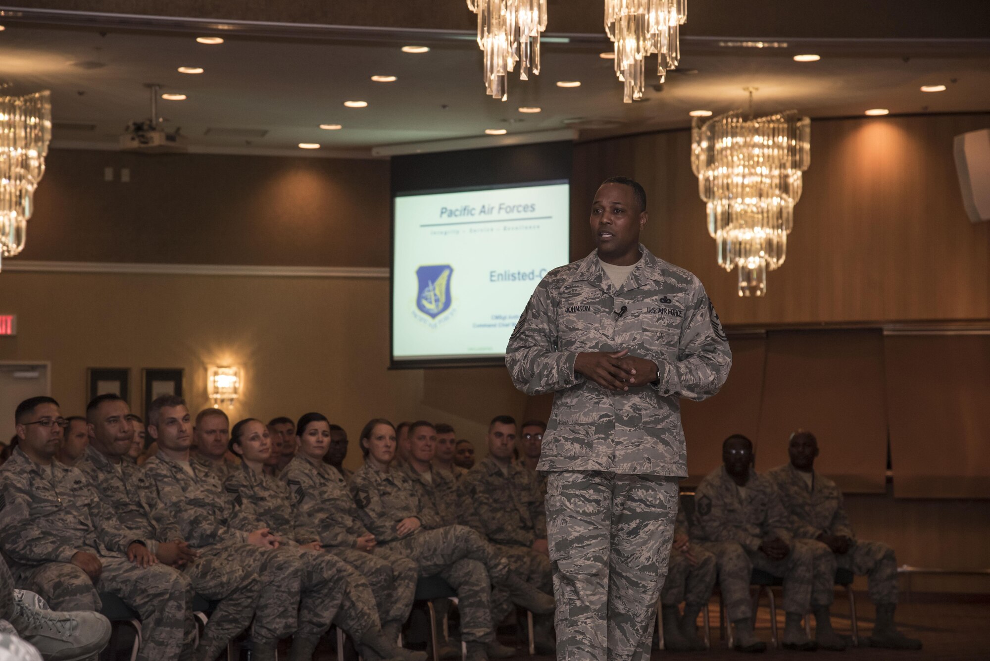 U.S. Air Force Chief Master Sgt. Anthony Johnson, the Pacific Air Forces' command chief, speaks during an elisted all call at Misawa Air Base, Japan, July 12, 2017. Johnson is touring all bases withing the PACAF major command to familiarize himself with each unit and identify challenges preventing Airmen from performing at their optimal level. (U.S. Air Force photo by Airman 1st Class Sadie Colbert)
