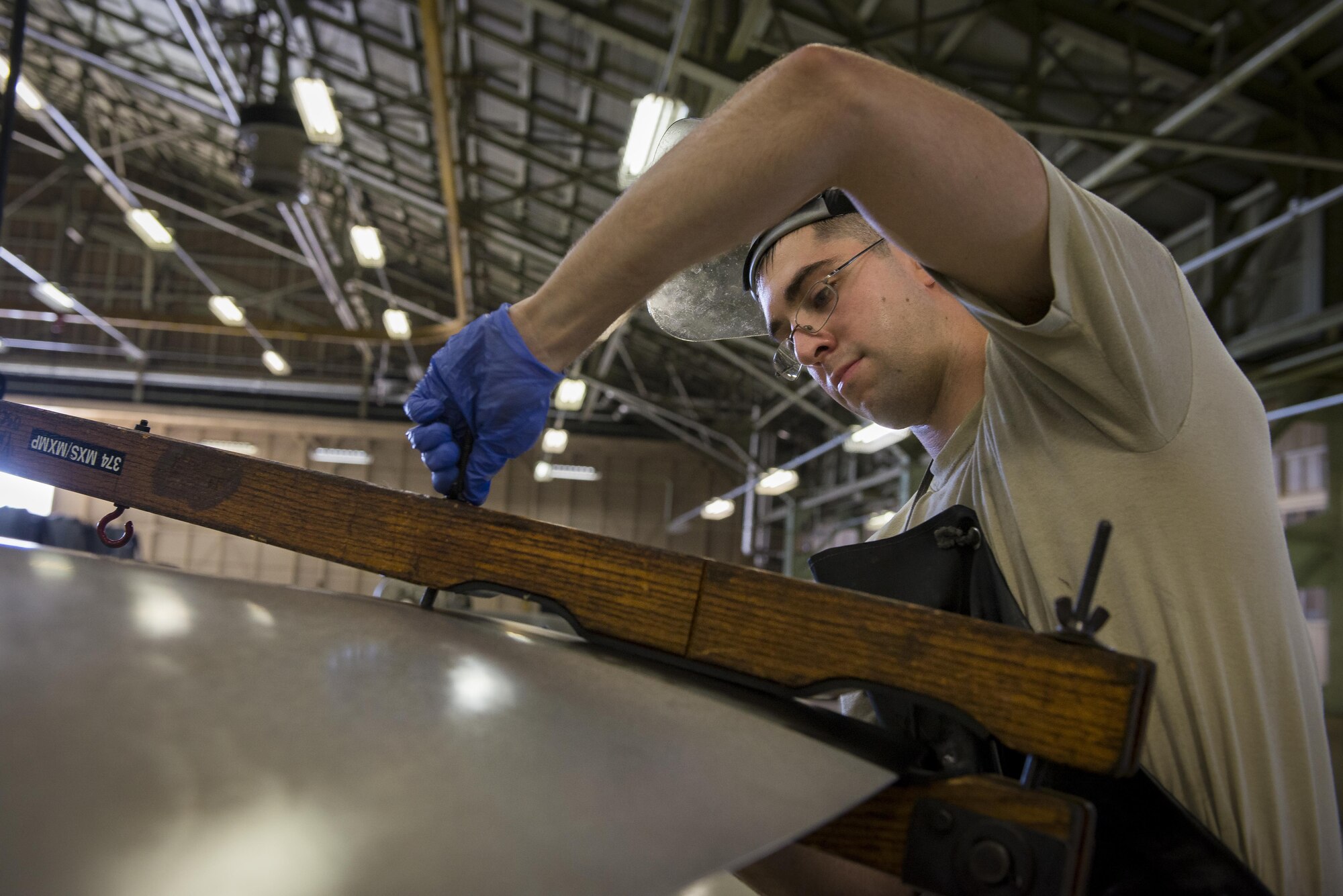 Senior Airman Jacob Lay, 374th Maintenance Squadron aerospace propulsion journeyman, tightens bolt on a blade bat during a MC-130 Talon II propeller test, July 12, 2017, at Yokota Air Base, Japan. This is the only time the propeller blades are turned aside from when they are attached to the aircraft. (U.S. Air Force photo by Airman 1st Class Donald Hudson)