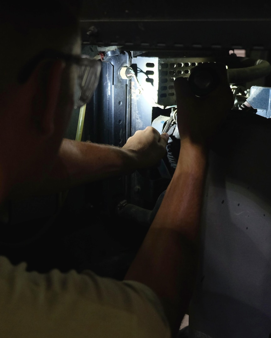 Senior Airman Nathan, 380th Expeditionary Maintenance Squadron aerospace ground equipment journeyman, inspects a floodlight July 12, 2017, at an undisclosed location in southwest Asia. AGE flight members work 24/7 overcoming obstacles in the AOR to ensure equipment needed to launch aircraft are always ready when needed. (U.S. Air Force photo by Senior Airman Preston Webb)