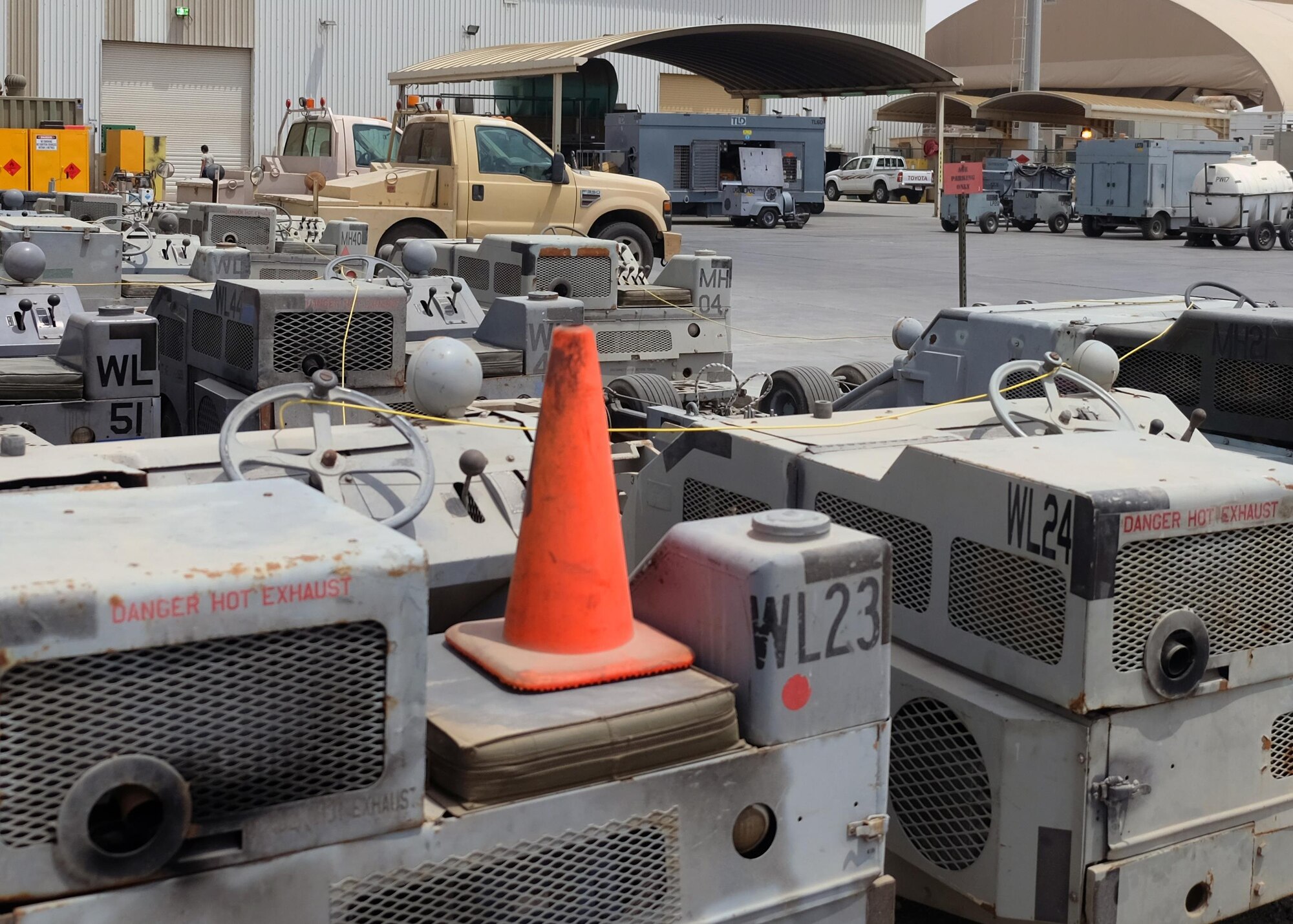 A fleet of aerospace ground equipment stands ready July 12, 2017, at an undisclosed location in southwest Asia. The 45-person Aerospace Ground Equipment flight maintains and repairs nearly 500 pieces of aerospace ground equipment to meet the demands of the airpower mission. (U.S. Air Force photo by Senior Airman Preston Webb)