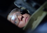 Senior Airman Austin, 380th Expeditionary Maintenance Squadron aerospace ground equipment journeyman, searches for an oil filter July 12, 2017, at an undisclosed location in southwest Asia.  AGE flight members work 24/7 overcoming obstacles in the AOR to ensure equipment needed to launch aircraft are always ready when needed. (U.S. Air Force photo by Senior Airman Preston Webb)