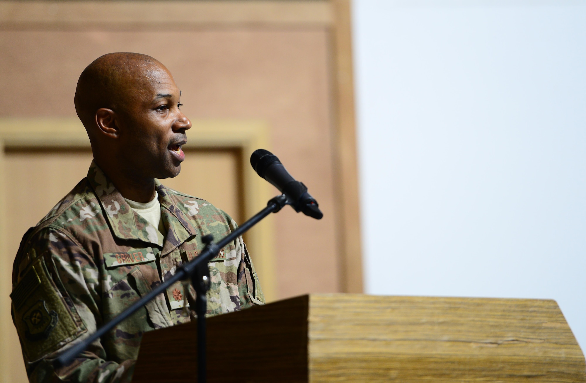 U.S. Air Force Maj. Charlie Grover addresses the 407th Expeditionary Communications Squadron Airmen for the first time as the new commander of the 407th ECS during the change of command ceremony on July 11, 2017 in Southwest Asia. The military’s change of command ceremony signifies the transfer of command. (U.S. Air Force Tech. Sgt. Andy M. Kin)