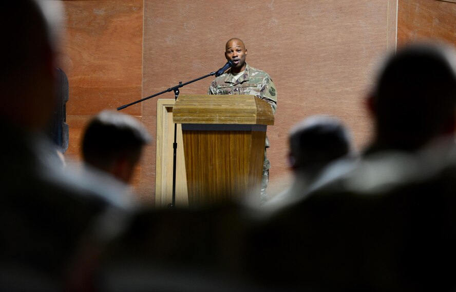 U.S. Air Force Maj. Charlie Grover addresses the 407th Expeditionary Communications Squadron Airmen for the first time as the new commander of the 407th ECS during the change of command ceremony on July 11, 2017 in Southwest Asia. The military’s change of command ceremony signifies the transfer of command. (U.S. Air Force Tech. Sgt. Andy M. Kin)