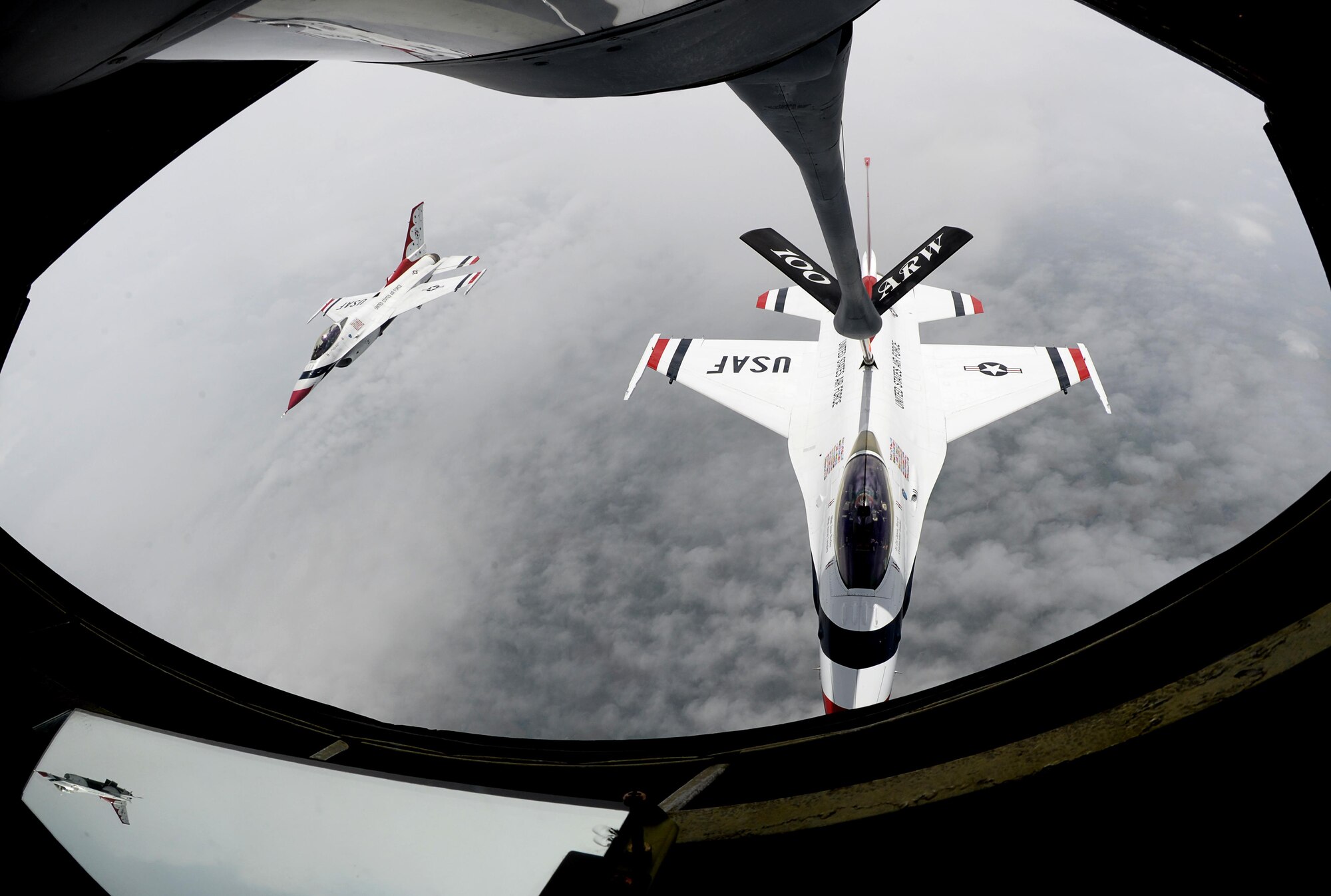 A U.S. Air Force Thunderbird receives fuel from a U.S. Air Force KC-135 Stratotanker assigned to the 351st Air Refueling Squadron, July 10, 2017, during a refueling mission over the United Kingdom. The Thunderbirds are in the European theater for Bastille Day and the 2017 Royal International Air Tattoo airshow. (U.S. Air Force photo by Senior Airman Justine Rho)