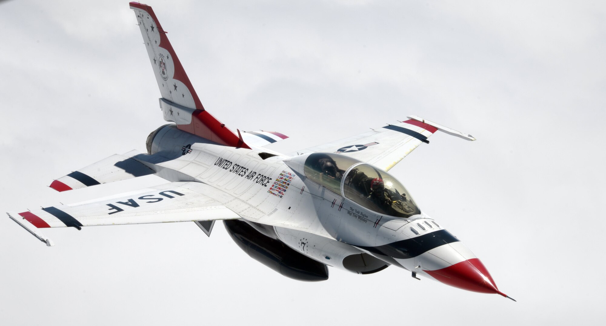 U.S. Air Force Thunderbird No. 8 flies around the formation with their photojournalist taking pictures of the squadron’s maneuvers July 10, 2017, over the Isle of Skye, Scotland. The Thunderbirds have dedicated aerial photographers to capture performances and formations from the air. (U.S. Air Force photo by Airman 1st Class Benjamin Cooper)