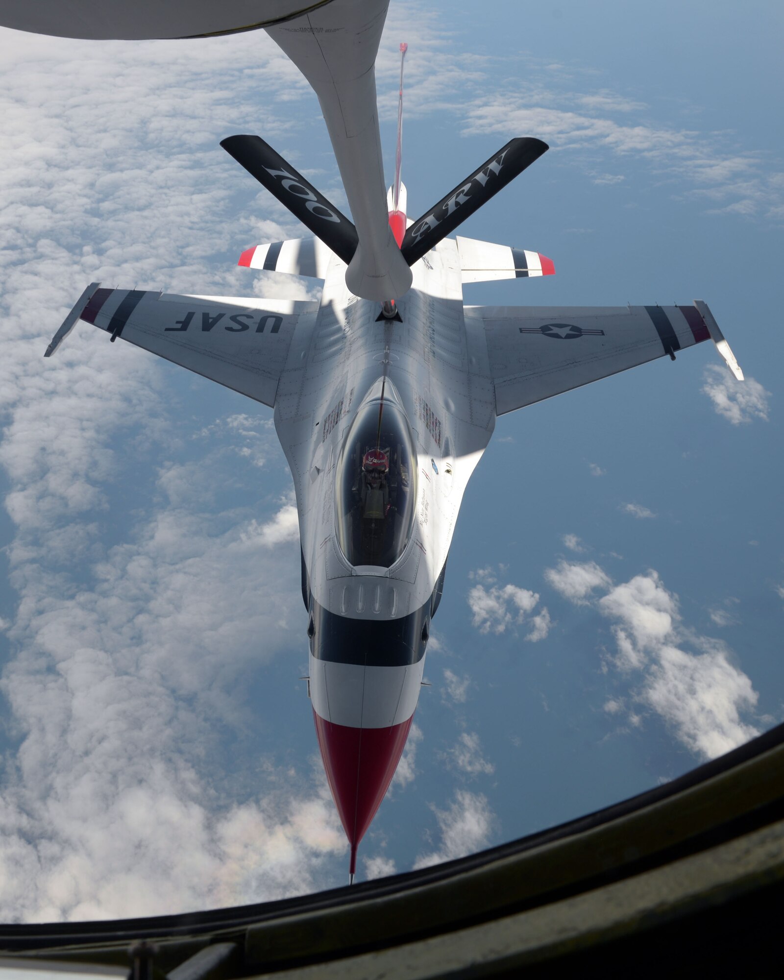 A U.S. Air Force Thunderbird receives fuel from a KC-135 Stratotanker assigned to the 100th Air Refueling Wing over the Isle of Skye, Scotland, July 10, 2017.  The Thunderbirds rehearsed their routines in preparation for the 2017 Royal International Air Tattoo airshow. (U.S. Air Force photo by Airman 1st Class Benjamin Cooper)