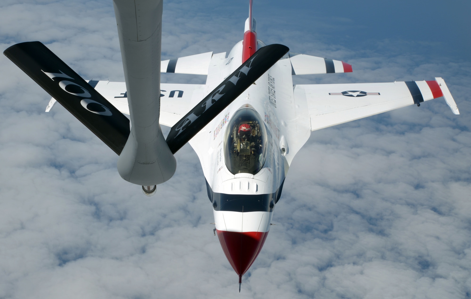 A U.S. Air Force Thunderbird pilot prepares to refuel from a KC-135 Stratotanker assigned to the 100th Air Refueling Wing July 10, 2017, over the Isle of Skye, Scotland. The Thunderbirds rehearsed their routines in preparation for the 2017 Royal International Air Tattoo airshow. (U.S. Air Force photo by Airman 1st Class Benjamin Cooper)
