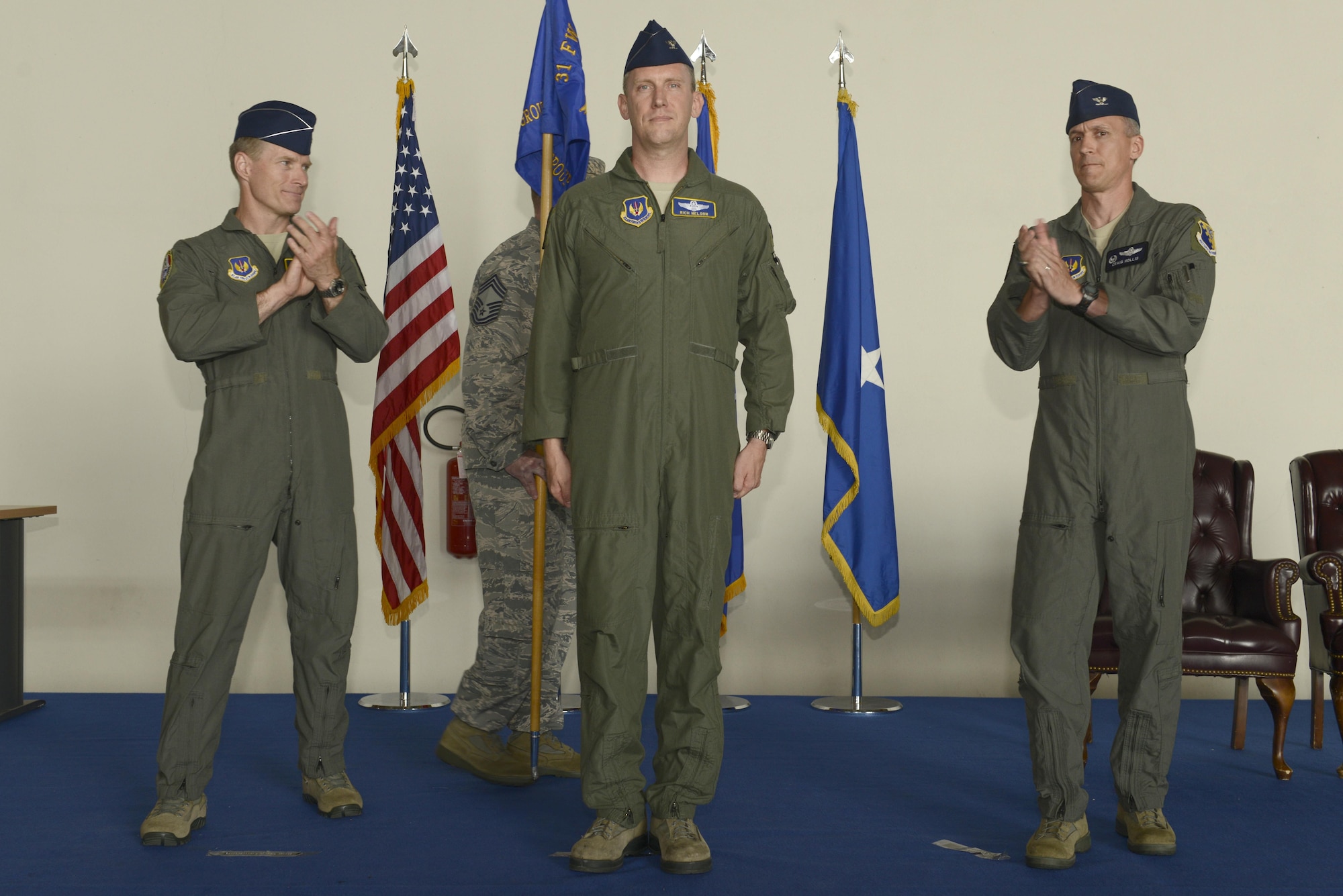 Col. Richard Nelson took command of the 31st Operations Group from Col. Craig Hollis during a change of command ceremony, July 10, 2017, at Aviano Air Base, Italy. Brig. Gen. Lance Landrum, 31st Fighter Wing commander, presided over the event. (U.S. Air Force photo by Tech. Sgt. Andrew Satran)