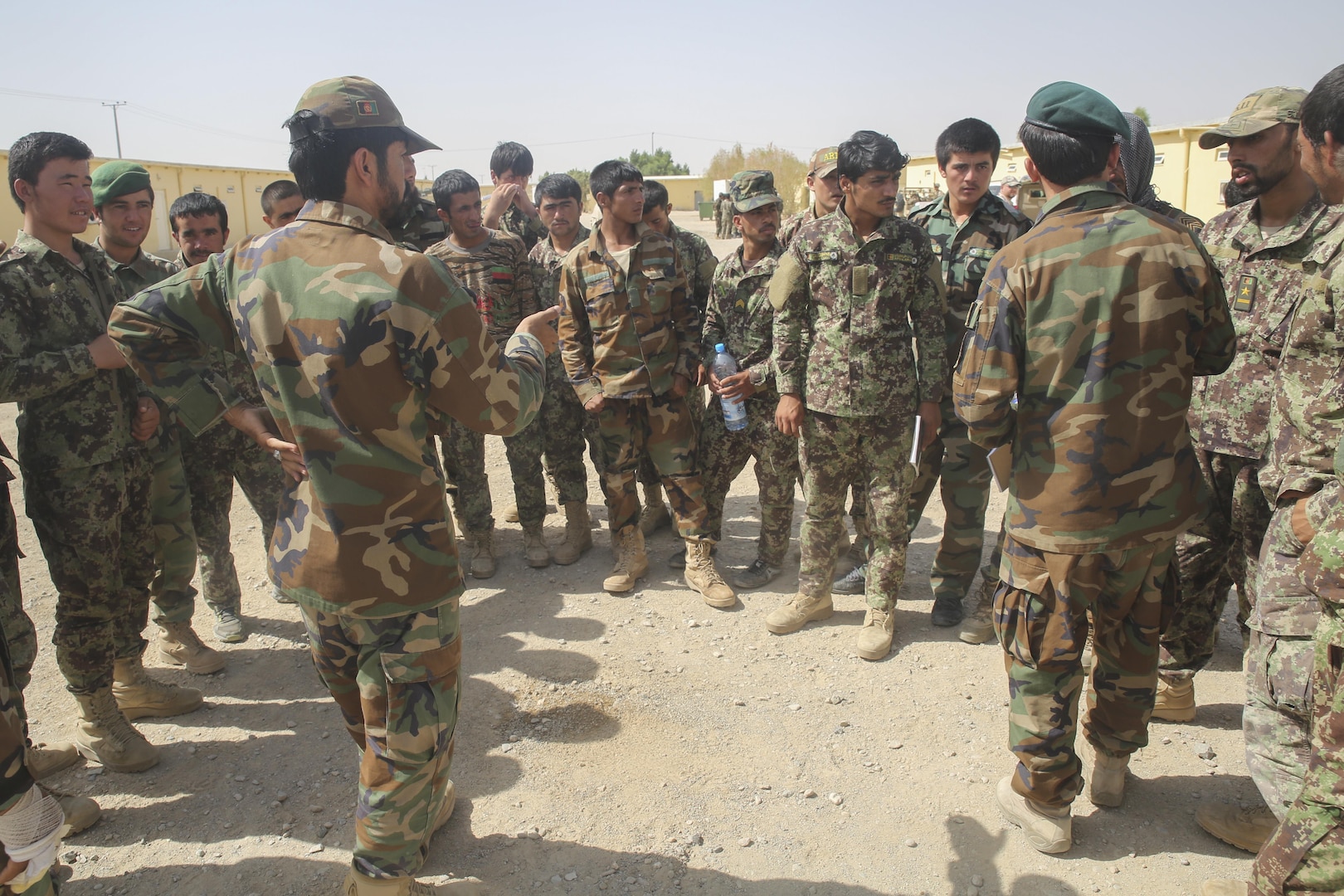 An Afghan National Army soldier with 215th Corps demonstrates disturbed earth patterns, a possible indicator of an improvised explosive device, at Camp Shorabak, Afghanistan, July 13, 2017. Approximately 70 soldiers with various units from 215th Corps recently began a route clearance course, which instructs students on proper counter IED procedures, helping to promote the maneuverability of infantry kandaks, supplies and civilians throughout Helmand Province. (U.S. Marine Corps photo by Sgt. Lucas Hopkins)