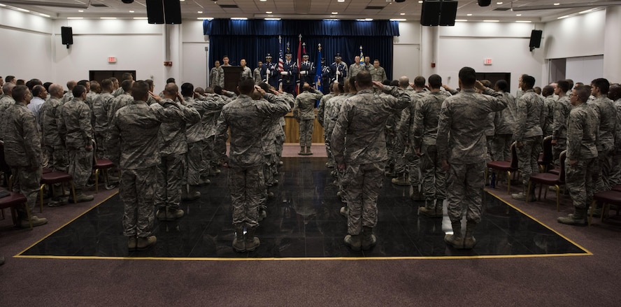 U.S. Airmen assigned to the 39th Air Base Wing, salute the colors during the 39th Mission Support Group change of command ceremony July 13, 2017, at Incirlik Air Base, Turkey. A change of command ceremony is a tradition that represents a formal transfer of authority and responsibility from the outgoing commander to the incoming commander. (U.S. Air Force photo by Airman 1st Class Devin M. Rumbaugh)