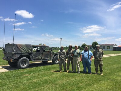 Lt. Col. Andrew Bates, commander of the 2nd Battalion, 138th Field Artillery thanks Robert Allen Jones Sr., for the Jones' family's cooperation in the battalion's signal operations, June 10, 2017, at the Jones family farm.