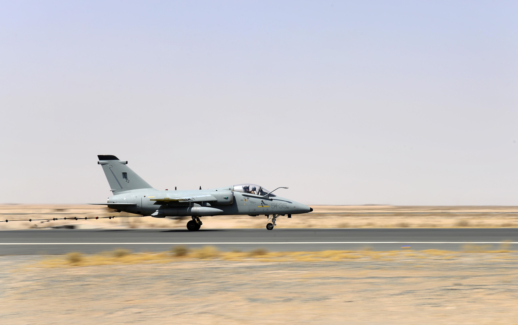 An Italian Air Force (ITAF) AMX A-11 Ghibli aircraft conducts an Aircraft Arresting System engagement during a simulated in-flight emergency in Southwest Asia on July 3, 2017. The AAS allows fighter aircraft to safely stop during an in-flight emergency during takeoff or landing. (U.S. Air Force photo by Tech. Sgt. Andy M. Kin)