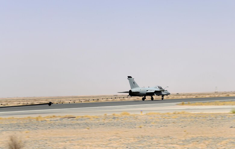 An Italian Air Force (ITAF) AMX A-11 Ghibli aircraft conducts an Aircraft Arresting System engagement during a simulated in-flight emergency in Southwest Asia on July 3, 2017. The AAS allows fighter aircraft to safely stop during an in-flight emergency during takeoff or landing. (U.S. Air Force photo by Tech. Sgt. Andy M. Kin)