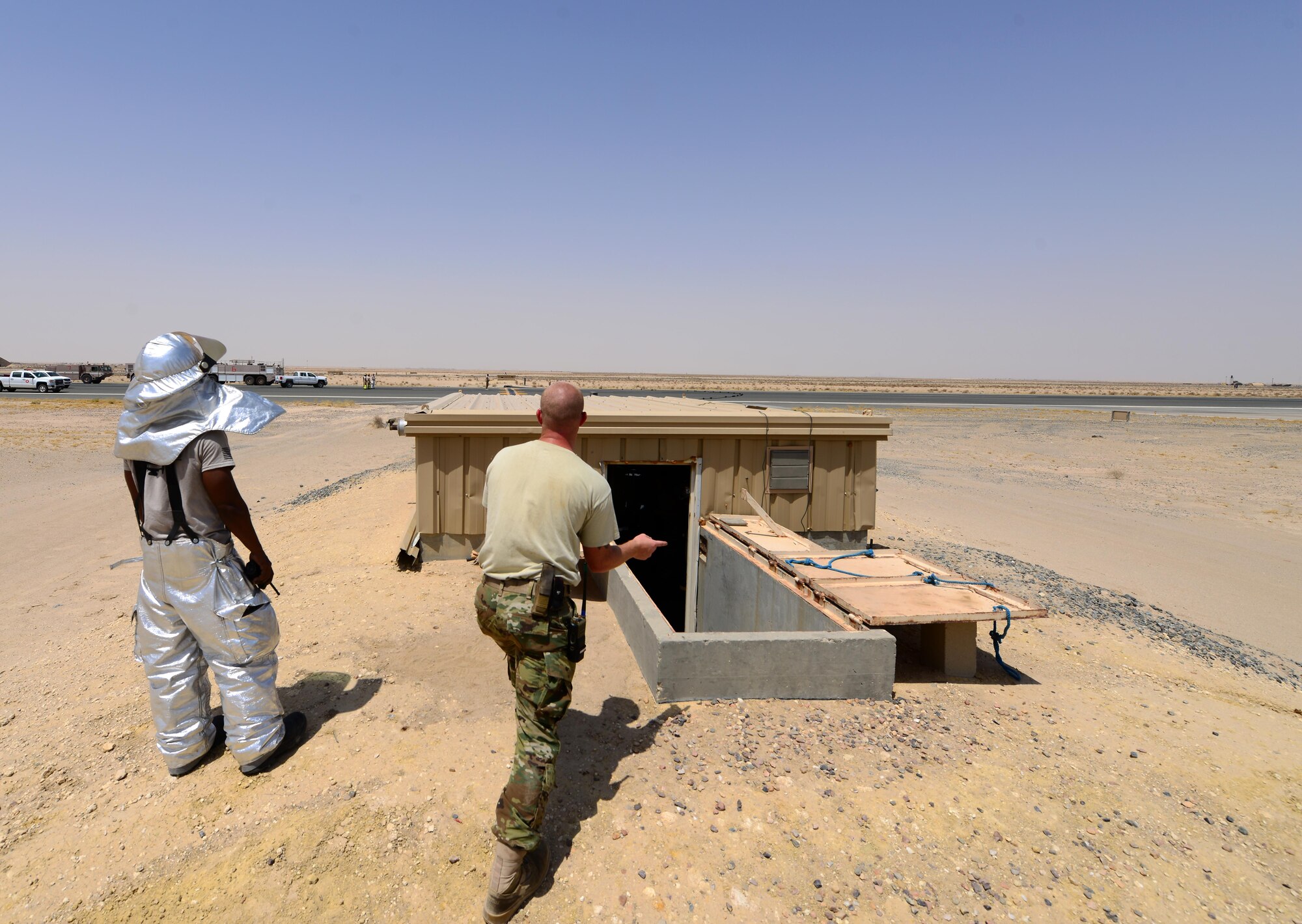U.S. Air Force power production technicians assigned to the 407th Expeditionary Civil Engineer Squadron, wind up the cable from the Barrier Arresting Kit (BAK-12) in Southwest Asia on July 3, 2017. 407th ECES conducted an Aircraft Arresting System engagement with an Italian AMX A-11 Ghibli aircraft during a simulated in-flight emergency. (U.S. Air Force photo by Tech. Sgt. Andy M. Kin)