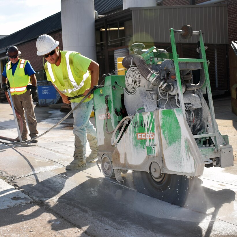 U.S. Army Corps of Engineers, Mobile District, contractors saw cut existing concrete to replace water and sewer lines at Anniston Army Depot, in Anniston, Ala. The Corps is replacing approximately 15,800 linear feet of 8-inch sewer and waste lines. The $10.2 million project is about 45 percent finished, with an expected construction completion time of 830 days.