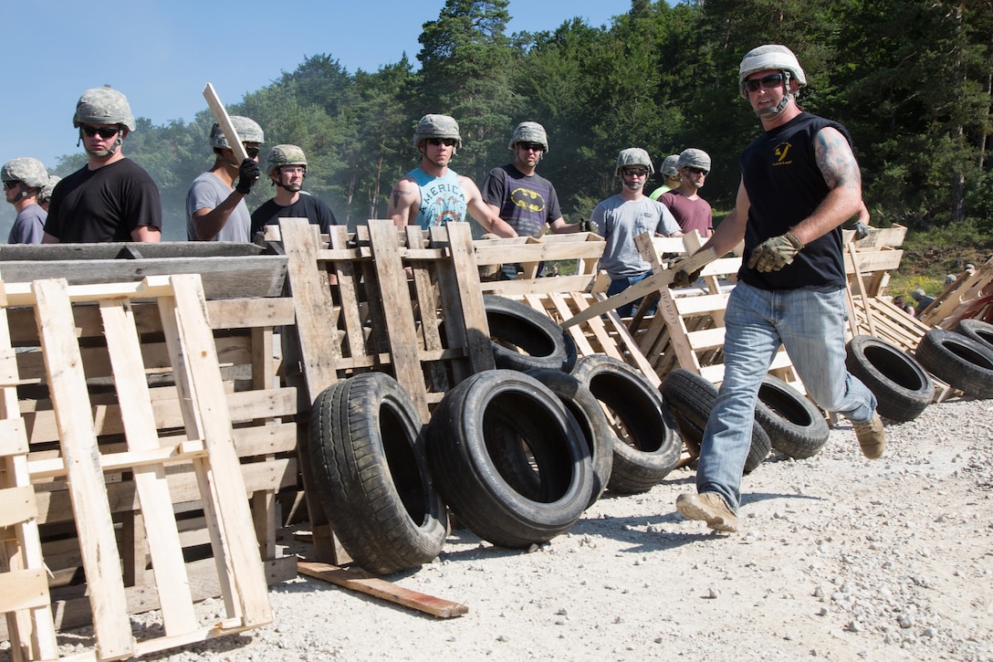 A soldier conducts a simulated riot while participating in a crowd riot control scenario during a Kosovo Force mission rehearsal exercise at the Joint Multinational Readiness Center in Hohenfels, Germany, July 5, 2017. The soldier is assigned to the Oklahoma National Guard. Army photo by Spc. Randy Wren